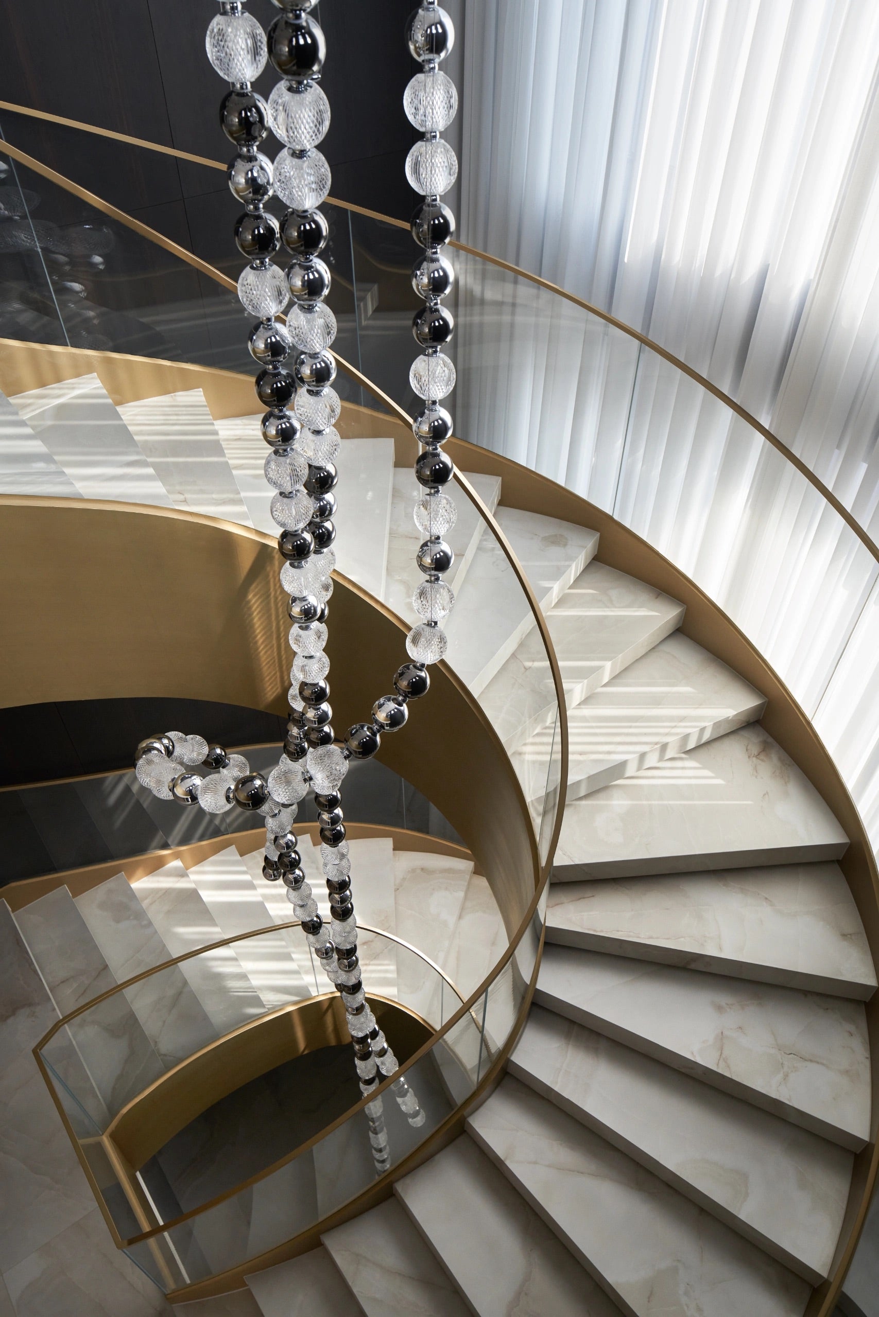 Luxury plating champagne curved staircase with pandora marble tread