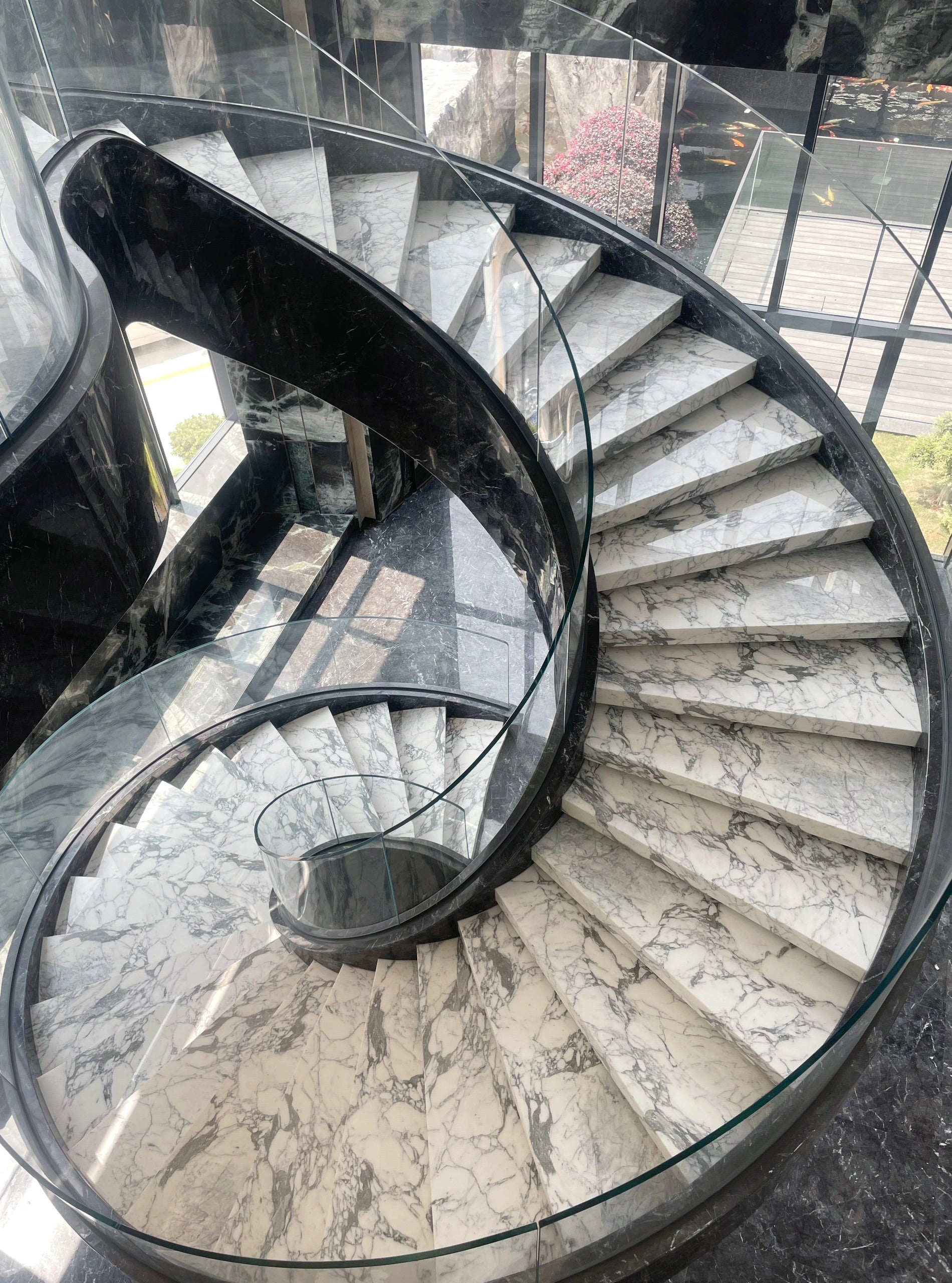 Luxe Marble Curved Staircase With Glass Railing