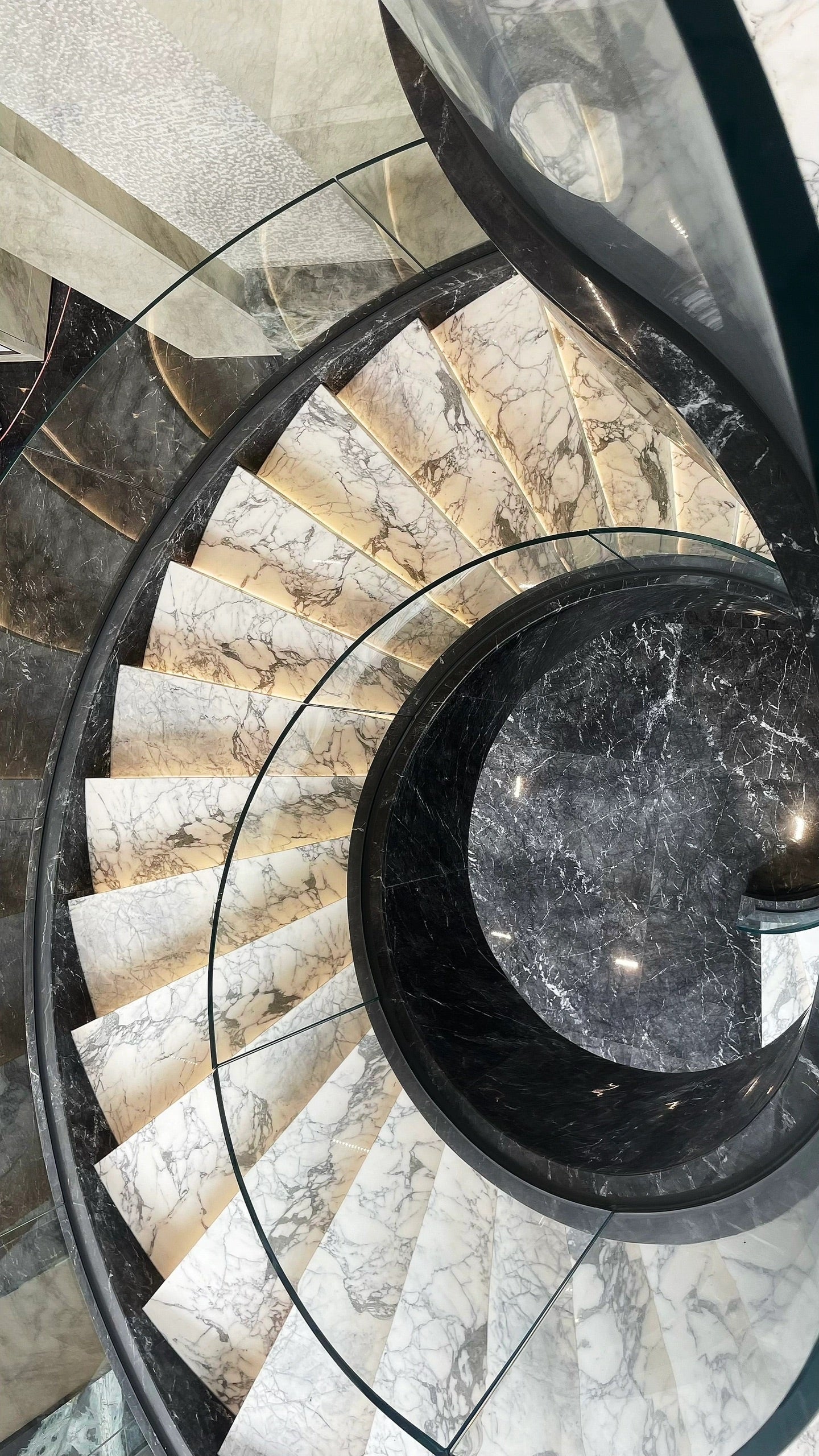 Luxe Marble Curved Staircase With Glass Railing