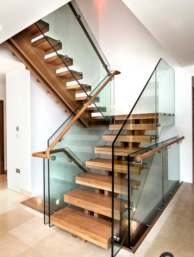 wooden straight staircase with glass railing