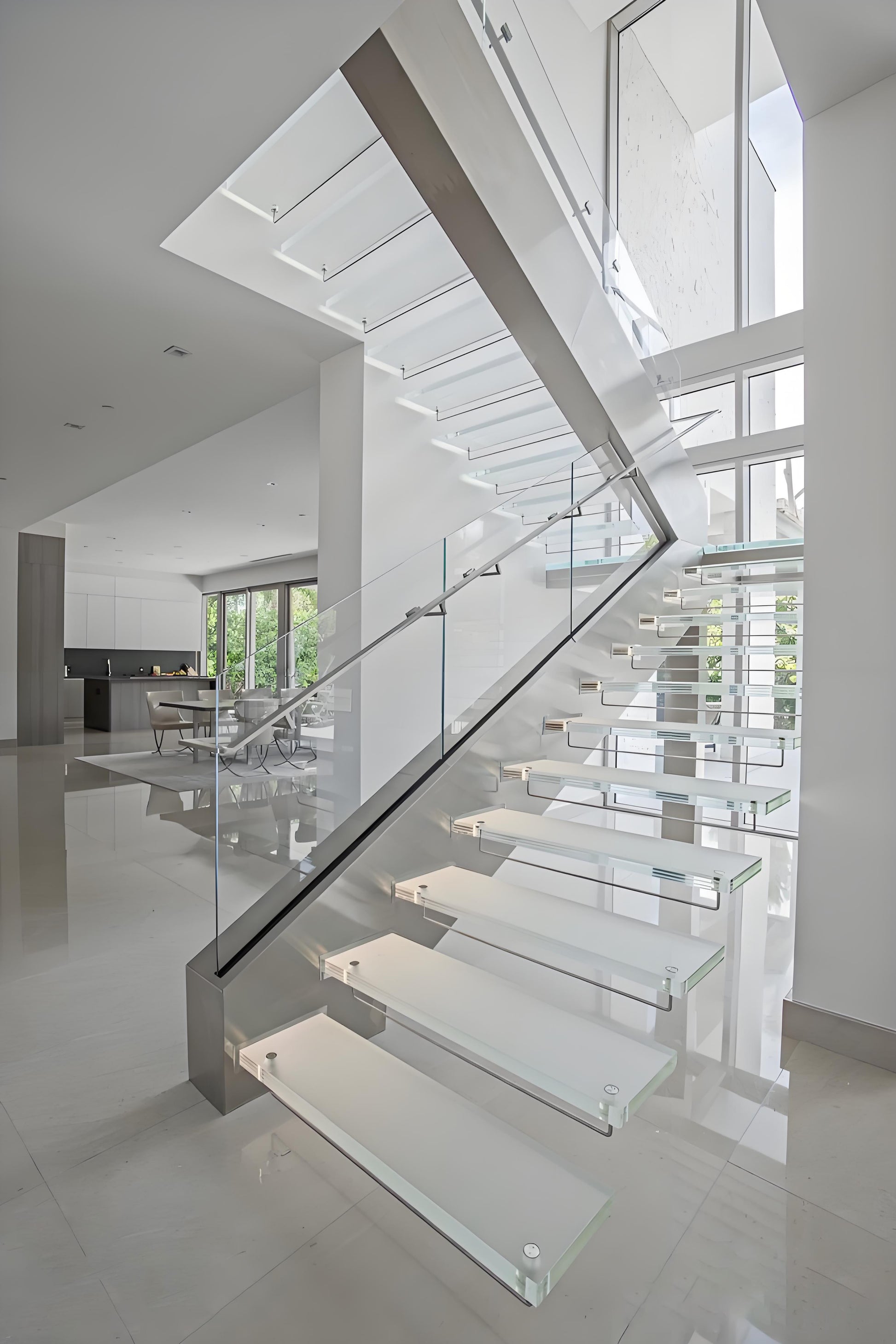 Modern single metal beam with glass tread straight staircase