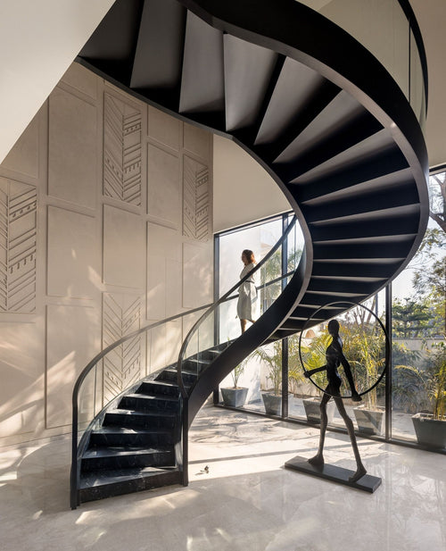 Black steel frame curved staircase with bend glass railing