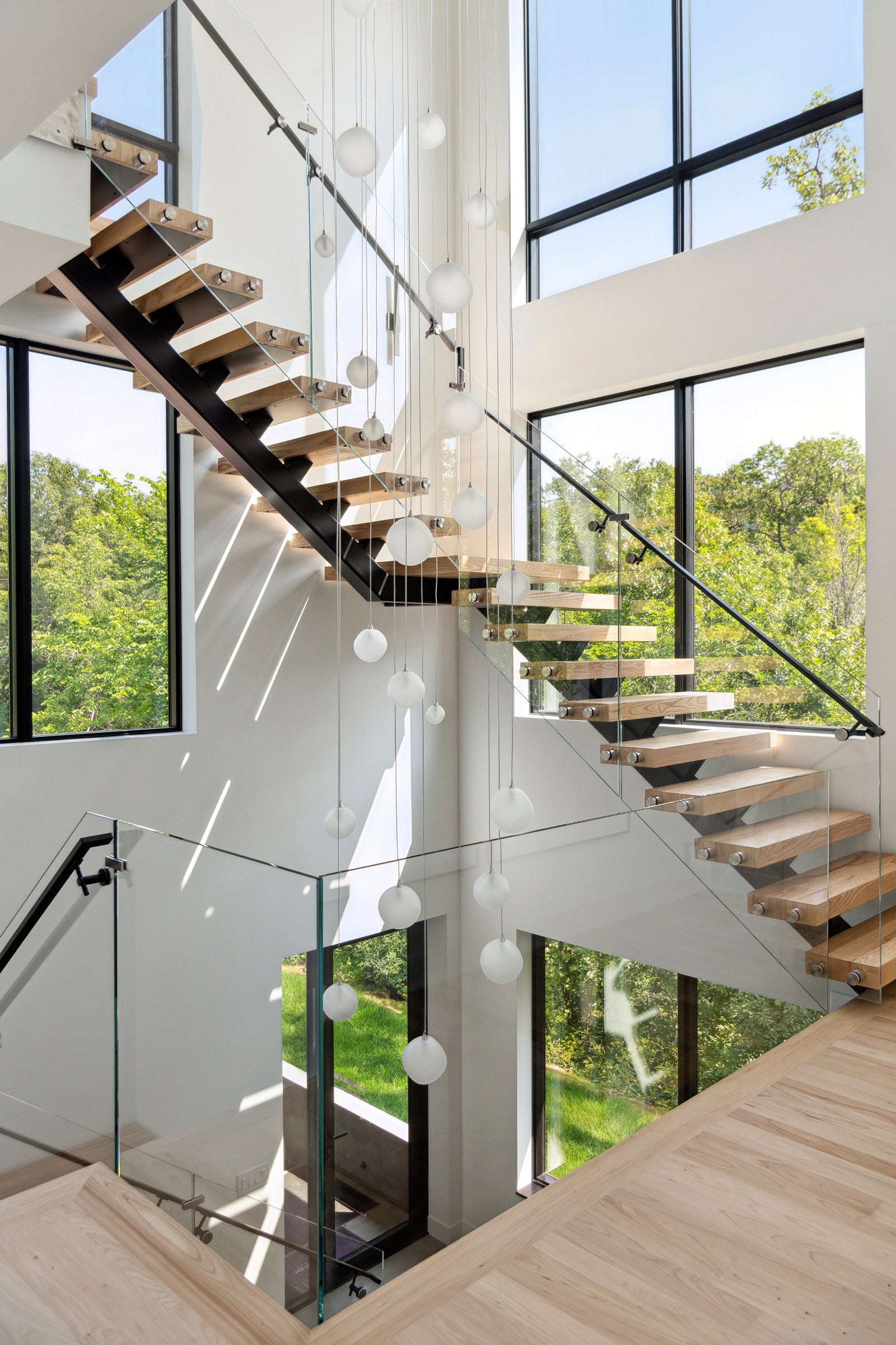 Modern center beam straight staircase with wooden tread glass railing